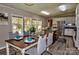 Well-lit kitchen and dining area featuring stainless steel appliances and an island at 14335 Saint Johns Dr # 83, Stanfield, NC 28163