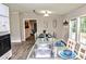 Kitchen and dining area featuring an island with sink and white cabinets at 14335 Saint Johns Dr # 83, Stanfield, NC 28163