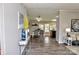 Open-concept living area connecting to a dining space, featuring cohesive decor and flooring at 14335 Saint Johns Dr # 83, Stanfield, NC 28163