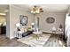 Comfortable living room featuring gray sofa, artistic decor, and neutral color scheme at 14335 Saint Johns Dr # 83, Stanfield, NC 28163