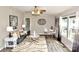 Cozy living room with plush gray sofa, decorative lighting, and windows for natural light at 14335 Saint Johns Dr # 83, Stanfield, NC 28163