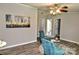Comfortable living room with ceiling fan and cozy teal seating at 14335 Saint Johns Dr # 83, Stanfield, NC 28163