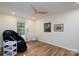 Bright bedroom with hardwood floors, light walls, modern ceiling fan, and natural light at 16132 Mclester Rd, Oakboro, NC 28129