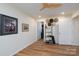 Bedroom featuring a light ceiling fan, storage for hats and shoes, and wood-look flooring at 16132 Mclester Rd, Oakboro, NC 28129