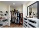 Walk-in closet featuring ample shelving, shoe racks, and full length mirror to provide practical storage solutions at 16132 Mclester Rd, Oakboro, NC 28129