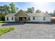 Charming single-story home with a covered front porch and well-maintained gravel yard at 16132 Mclester Rd, Oakboro, NC 28129