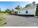 Charming single-story home with a covered front porch and well-maintained gravel yard at 16132 Mclester Rd, Oakboro, NC 28129