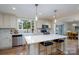 Bright kitchen with island, stainless appliances, and modern finishes exudes style at 16132 Mclester Rd, Oakboro, NC 28129