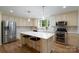Well-appointed kitchen features stainless steel appliances, island, and ample counter space at 16132 Mclester Rd, Oakboro, NC 28129