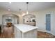 Open-concept layout connects the kitchen, dining area, and living room for seamless living at 16132 Mclester Rd, Oakboro, NC 28129
