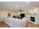 Spacious living room featuring hardwood floors, fireplace, and abundant natural light at 16132 Mclester Rd, Oakboro, NC 28129