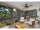 Relaxing screened-in porch with wood furniture and peaceful outdoor views at 16132 Mclester Rd, Oakboro, NC 28129