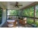 Inviting screened-in porch with comfortable seating and scenic wooded views at 16132 Mclester Rd, Oakboro, NC 28129