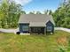 Spacious backyard featuring a well-maintained lawn, fenced perimeter, and outdoor seating, perfect for outdoor enjoyment at 1622 Hunters Place Rd, York, SC 29745