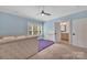 Bedroom with blue walls featuring carpet, a ceiling fan, and an ensuite bathroom entrance at 1622 Hunters Place Rd, York, SC 29745