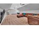 Expansive bonus room with vaulted ceiling and carpet flooring, featuring ample seating and a view into the hall at 1622 Hunters Place Rd, York, SC 29745