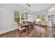 Bright dining room with hardwood floors, modern lighting, and large windows at 1622 Hunters Place Rd, York, SC 29745