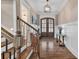 Elegant foyer features hardwood floors, wainscoting, and stylish lighting fixtures at 1622 Hunters Place Rd, York, SC 29745