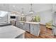 The modern, open concept kitchen with stainless appliances, a large island, and an island sink at 1622 Hunters Place Rd, York, SC 29745