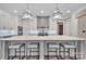 Modern kitchen island with seating, pendant lighting, and stainless steel appliances perfect for entertaining and dining at 1622 Hunters Place Rd, York, SC 29745