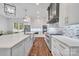 Bright, modern kitchen features a large island, stainless steel appliances, and hardwood floors at 1622 Hunters Place Rd, York, SC 29745