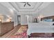 This main bedroom boasts a trey ceiling, hardwood floors, and a barn door at 1622 Hunters Place Rd, York, SC 29745