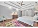 Tranquil main bedroom with tray ceilings, hardwood floors, and a decorative ceiling fan at 1622 Hunters Place Rd, York, SC 29745