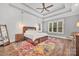 This main bedroom boasts tray ceilings, hardwood floors, and decorative lighting at 1622 Hunters Place Rd, York, SC 29745