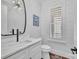 Stylish powder room featuring modern fixtures, shiplap walls, and unique light fixture, offering contemporary elegance at 1622 Hunters Place Rd, York, SC 29745