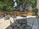 The beautiful backyard features a paver patio, multiple seating areas, and a built in grill at 17732 Kings Point Dr, Cornelius, NC 28031