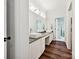 Well-lit bathroom with double vanity, granite countertop, and a separate door leading to a walk-in shower at 17732 Kings Point Dr, Cornelius, NC 28031