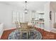 Charming dining area with a round table, pendant lighting, and views into the kitchen at 17732 Kings Point Dr, Cornelius, NC 28031