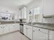 Bright kitchen with granite countertops, stainless steel appliances, and white cabinetry for a modern look at 17732 Kings Point Dr, Cornelius, NC 28031