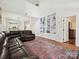 Open-concept living area featuring built-in shelving, hardwood floors and spacious design at 17732 Kings Point Dr, Cornelius, NC 28031