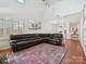 Bright and airy living room with high ceilings, plantation shutters and open layout, perfect for entertaining at 17732 Kings Point Dr, Cornelius, NC 28031