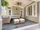 Covered patio with comfortable seating, ceiling fan, and outdoor access at 17732 Kings Point Dr, Cornelius, NC 28031