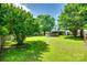 The backyard features a well-maintained lawn, mature trees, and an above-ground pool at 1791 Rosewell Dr # 65, Rock Hill, SC 29732