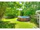 Enjoy this expansive backyard with mature trees and an above-ground pool for outdoor fun at 1791 Rosewell Dr # 65, Rock Hill, SC 29732