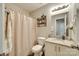 This full bath features a vanity with granite countertop, a framed mirror and a shower with curtain at 1791 Rosewell Dr # 65, Rock Hill, SC 29732