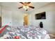 Bright bedroom with a ceiling fan, television, and two closets at 1791 Rosewell Dr # 65, Rock Hill, SC 29732