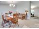 Formal dining room featuring wood furniture, chandelier, and a living space view at 1791 Rosewell Dr # 65, Rock Hill, SC 29732