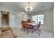 Bright formal dining area features a chandelier and adjoins staircase and additional space at 1791 Rosewell Dr # 65, Rock Hill, SC 29732