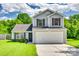 Charming two-story home with a two-car garage and well-manicured front lawn at 1791 Rosewell Dr # 65, Rock Hill, SC 29732