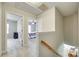 Upstairs hallway leading to bedrooms with neutral tones and carpeted floors at 1791 Rosewell Dr # 65, Rock Hill, SC 29732