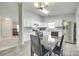 Well-lit kitchen with white cabinets, stainless steel appliances, and a dining area at 1791 Rosewell Dr # 65, Rock Hill, SC 29732