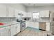 Modern kitchen with stainless steel appliances, granite countertops, and white cabinets at 1791 Rosewell Dr # 65, Rock Hill, SC 29732