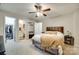 Inviting main bedroom featuring plush carpet, a ceiling fan, and ensuite bathroom access at 1791 Rosewell Dr # 65, Rock Hill, SC 29732
