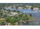 Aerial view of a waterfront property featuring lush trees, a lakeside location, and neighborhood views at 18118 Pompano Pl, Cornelius, NC 28031