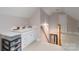 Finished attic space with sink, storage, lighting, and an open stairwell at 18118 Pompano Pl, Cornelius, NC 28031