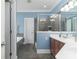 Stylish bathroom with tiled shower, garden tub, and single vanity at 18118 Pompano Pl, Cornelius, NC 28031